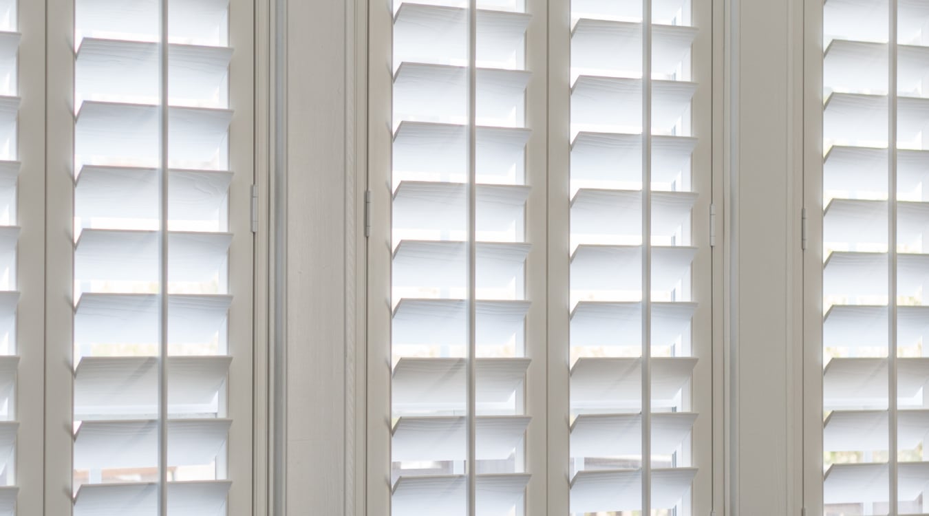Plantation shutters on commercial windows